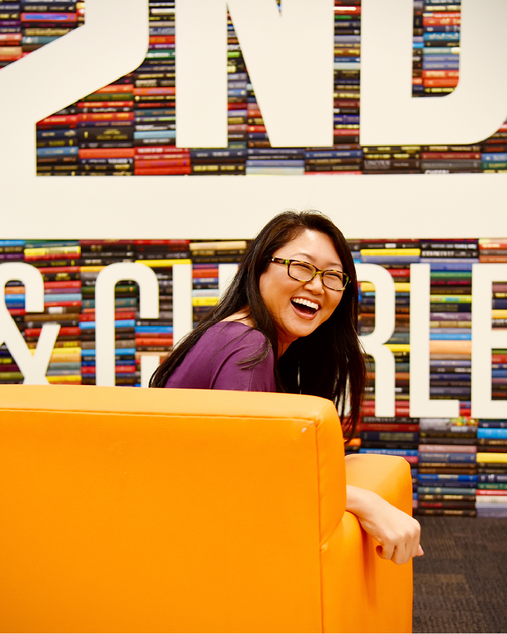 2nd & Charles girl smiling in store.