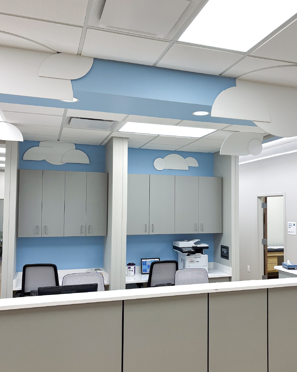 Christ Healt Pediatrics environmental pediatrics nurse desks clouds.